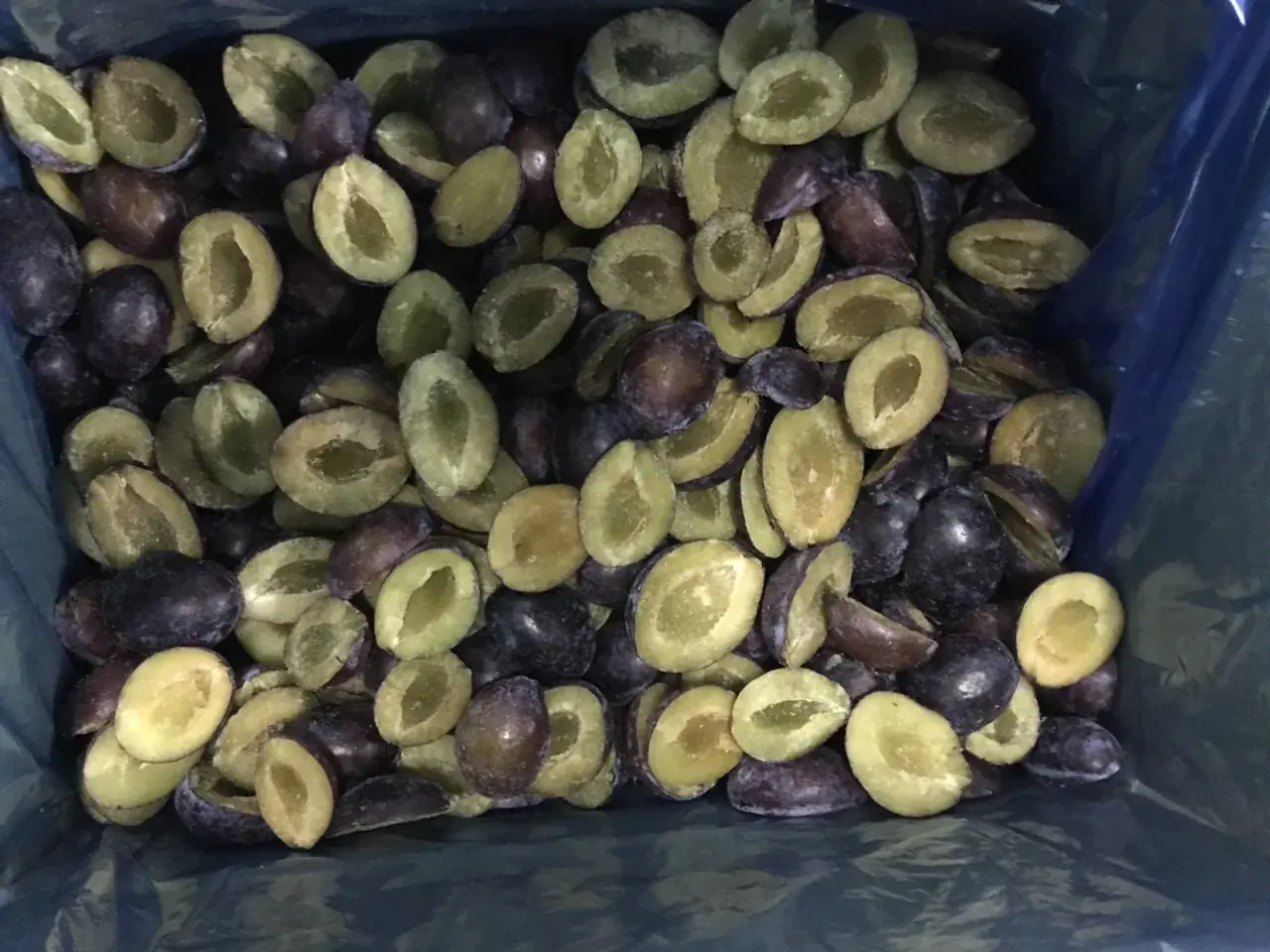Frozen plum halves